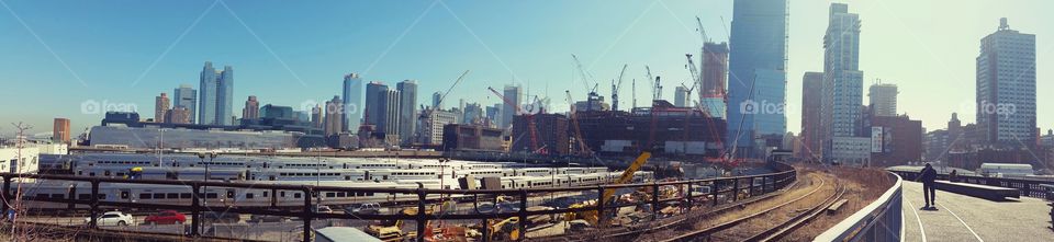 Panorama of Subway Cars & City Skyline.  Captured from the Highline in Manhattan, New York 2016