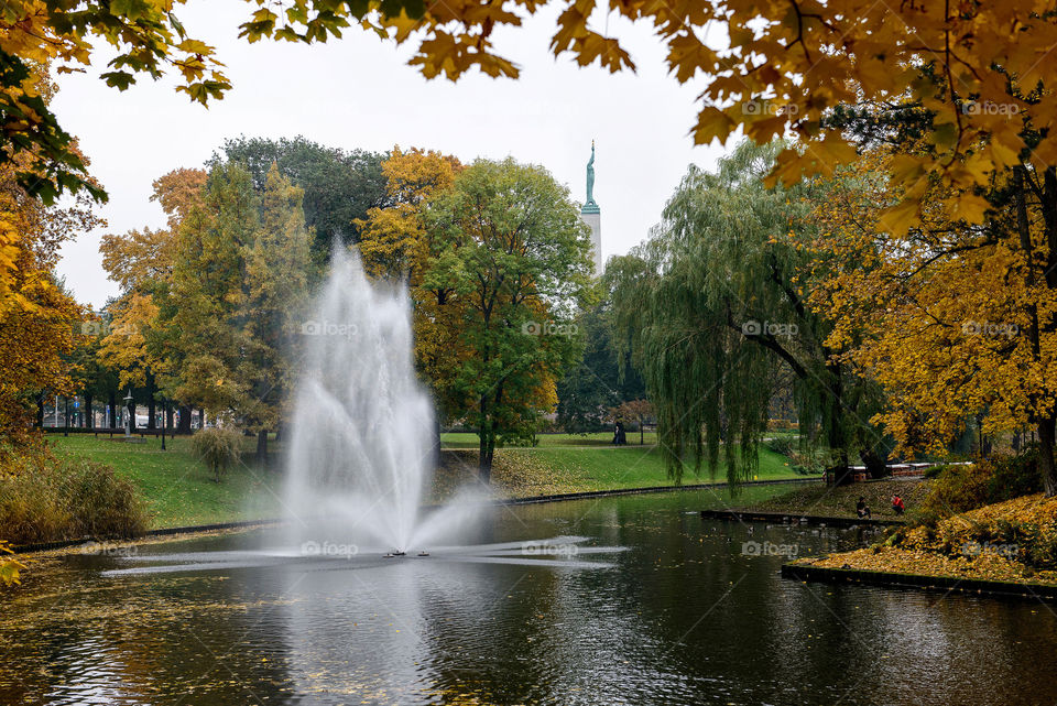 autumn scene, fountain in the Riga city canal