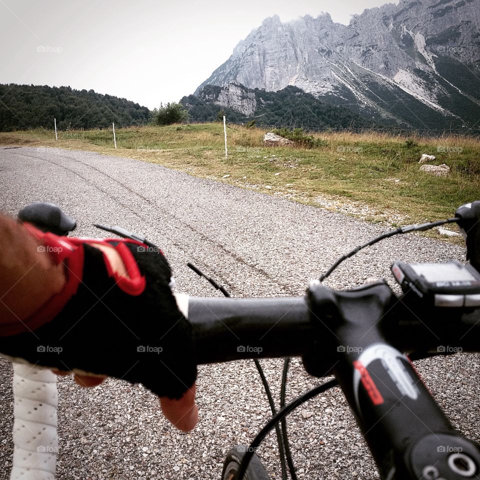 view of mountains from the handlebar of a bike