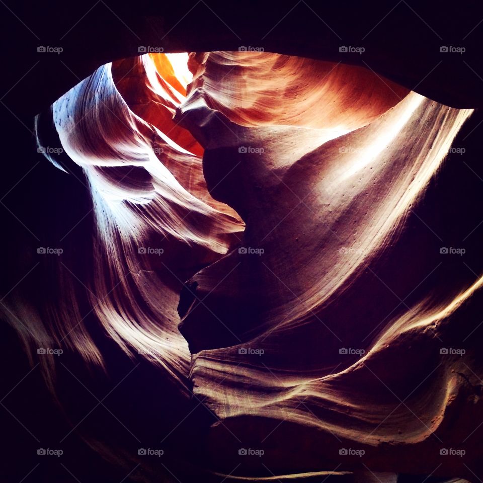 The heart of Antelope Canyon. Light is just beginning to filter down into the dark slot from this unique portal. 