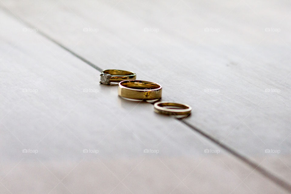 Bride and groom's wedding rings in a line