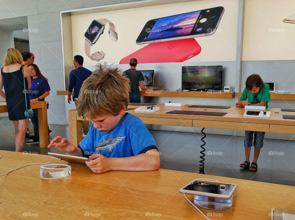 Young Boy In Apple Store

