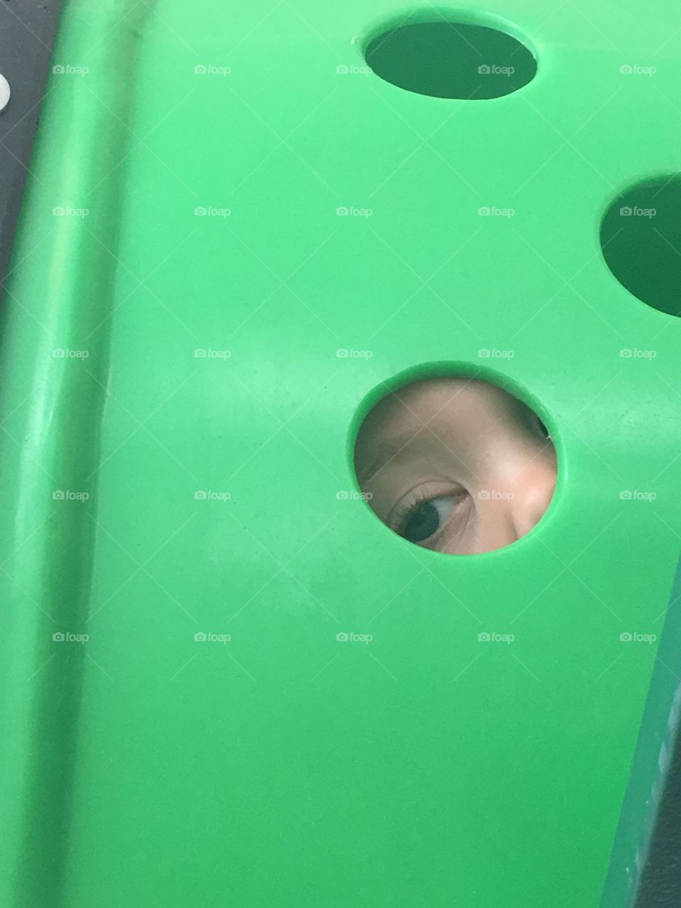 At the playground in a car dealership