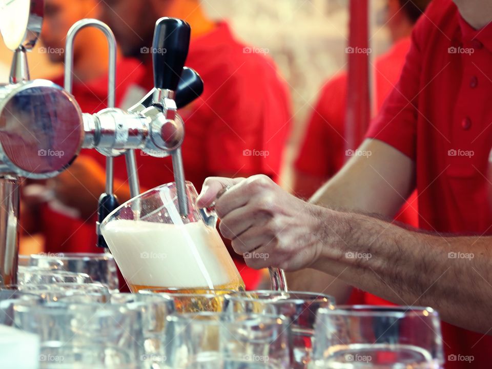 Bartender pouring beer 
