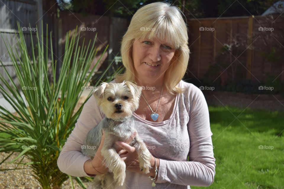 Portrait of senior woman with Yorkshire Terrier
