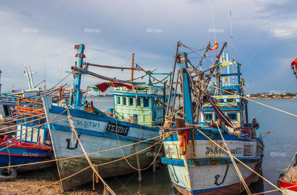 Thai Fisherman's boats at a fishing Pier in Thailand Southeast Asia