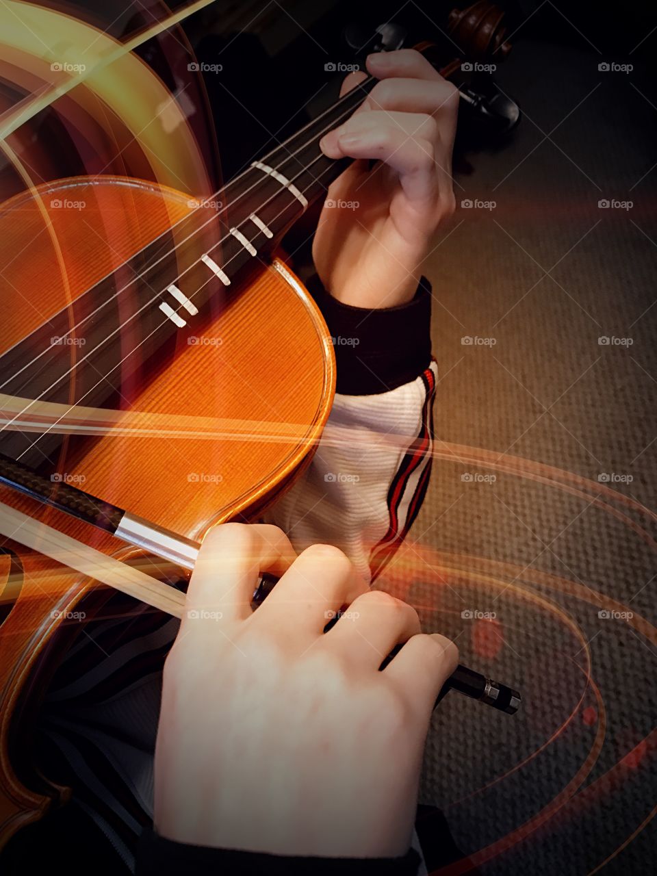 Light and sound. Color hands Playing Violin 