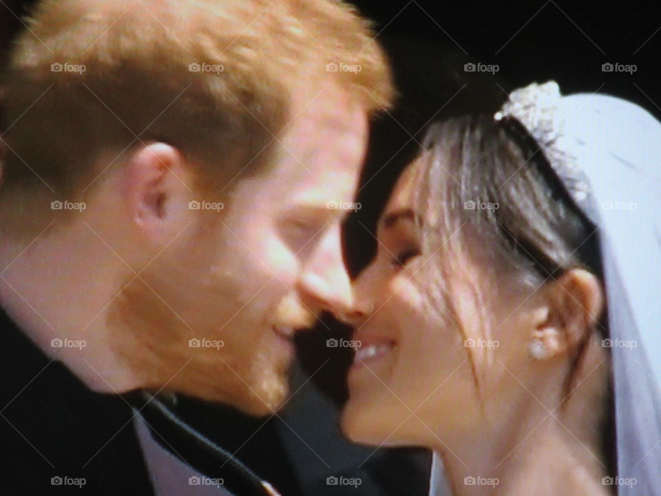 Harry and Meghan having their 1st kiss after a amazing wedding ceremony (photo taken from tv screen)
