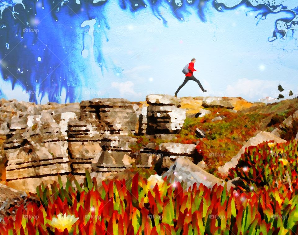 A heavily stylised image of a man leaping across a gap in the rocks