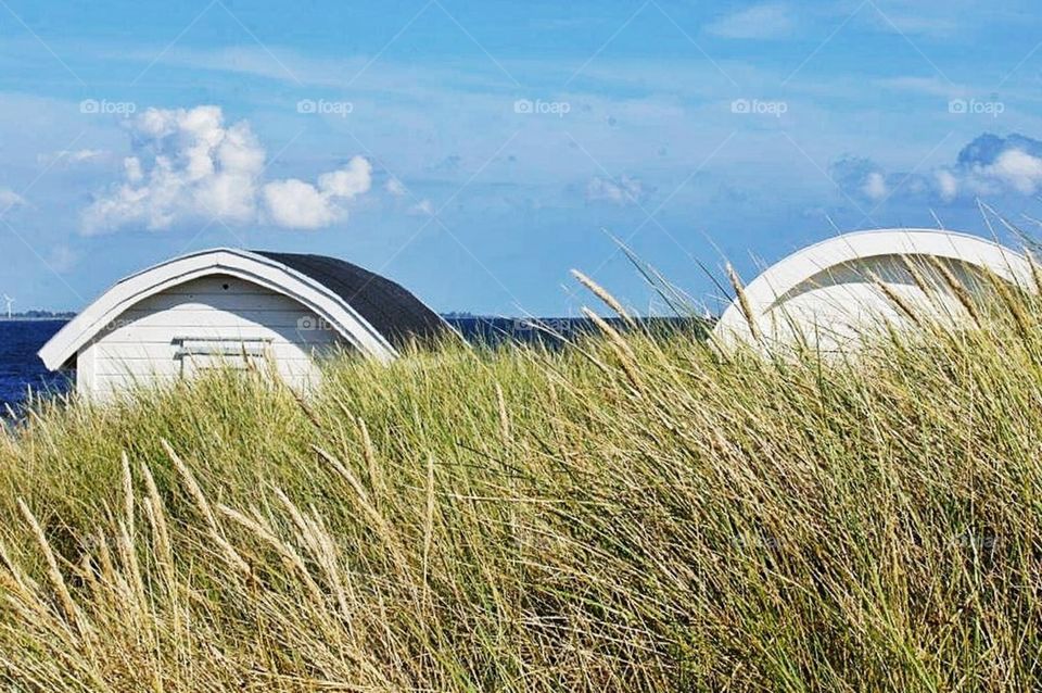 Beach huts in sand dunes