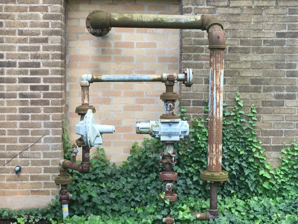 Pipe works outside an old school building