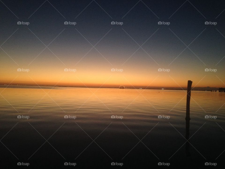 Beyond the beach in cancun . Lagoon sunset 