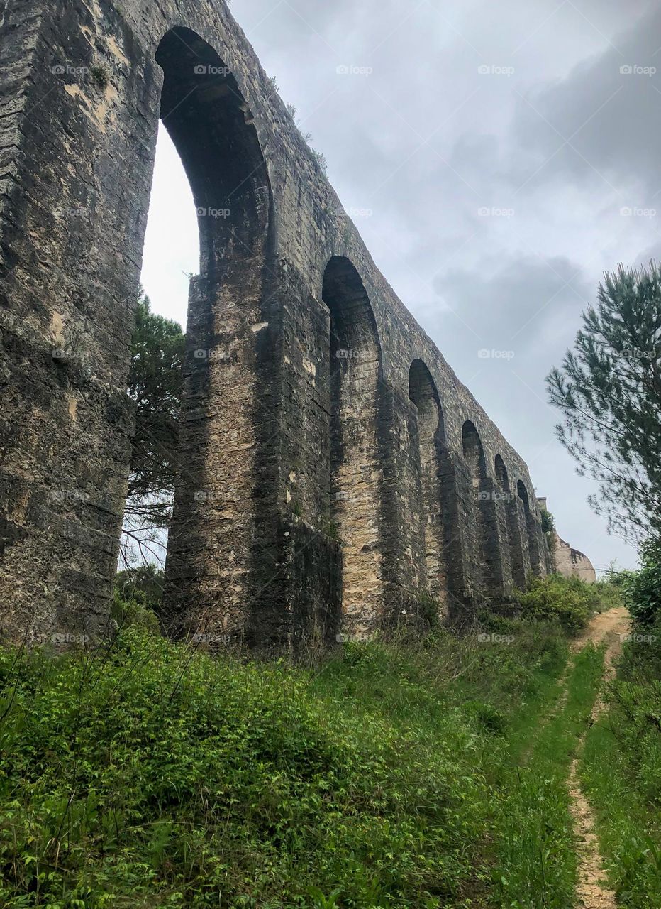 Pegões Aqueduct towers above us