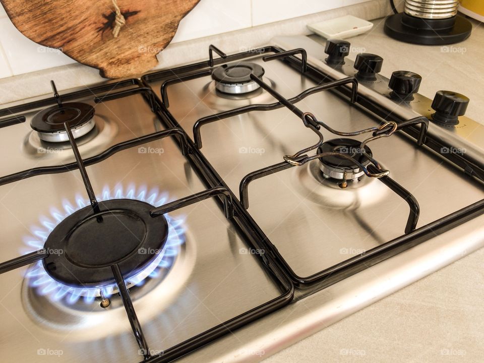 Burning stove on a metallic kitchen