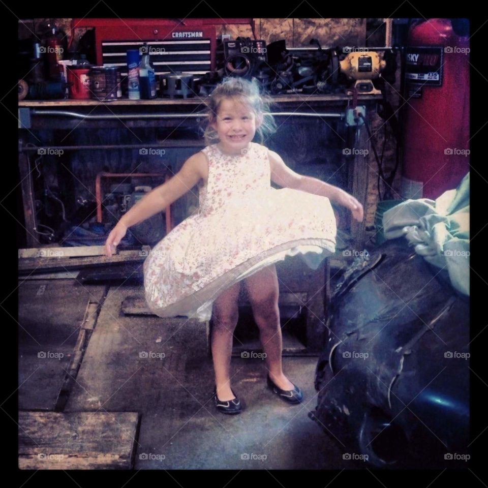 little girl in the car shop