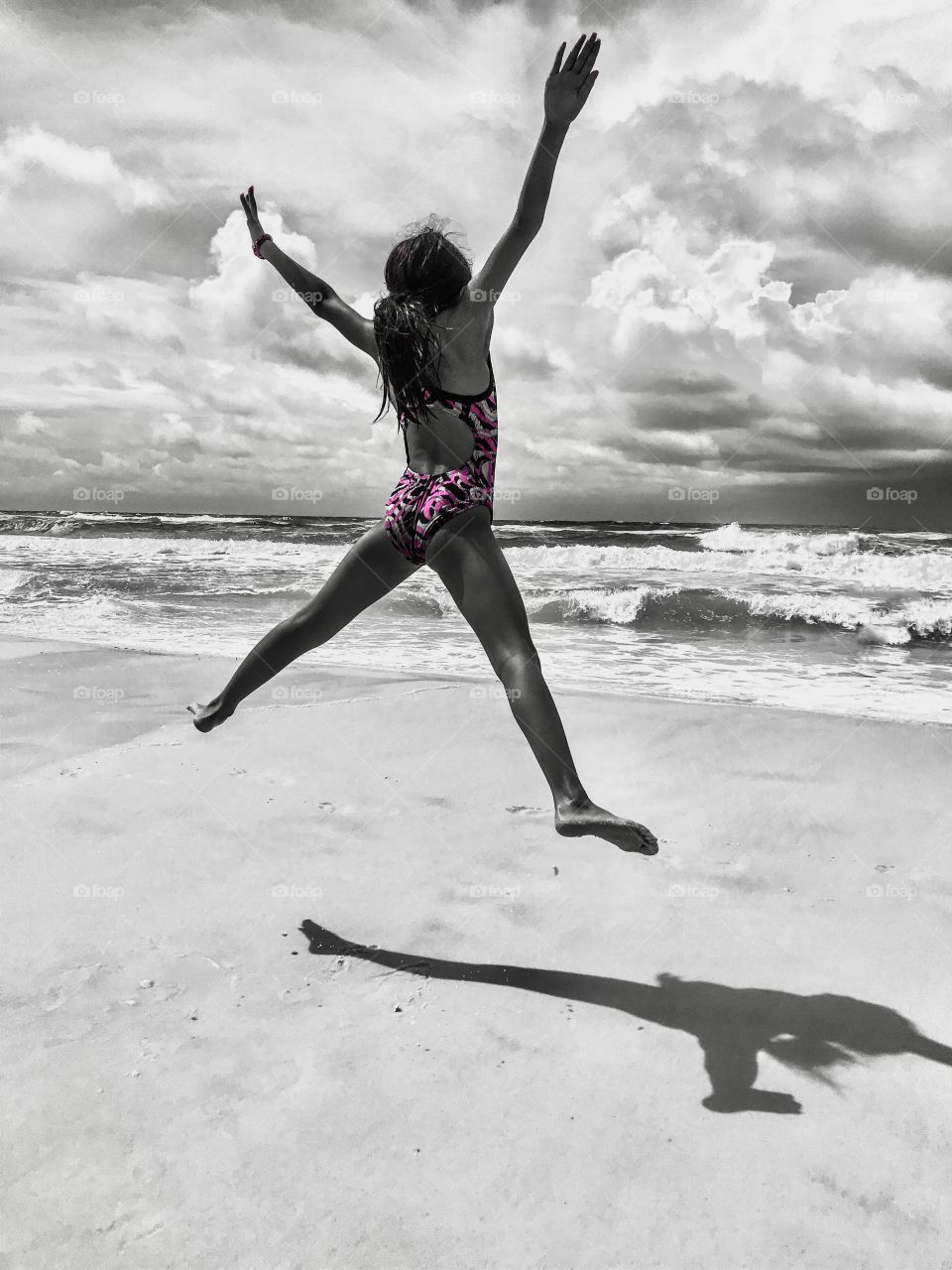 Jumping for joy to be at the beach