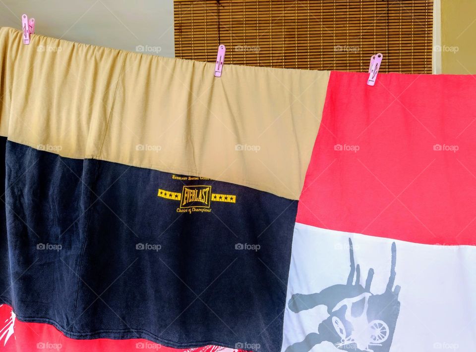 An old t-shirt blanket. Reuse concept.