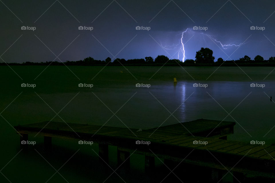 Lightning bolt near a lake in the Netherlands.