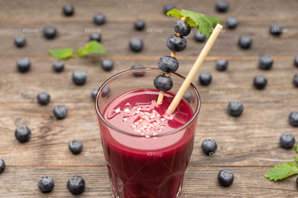 blueberry smoothie in a glass