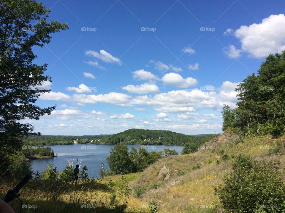 Blues skies over lake and hills