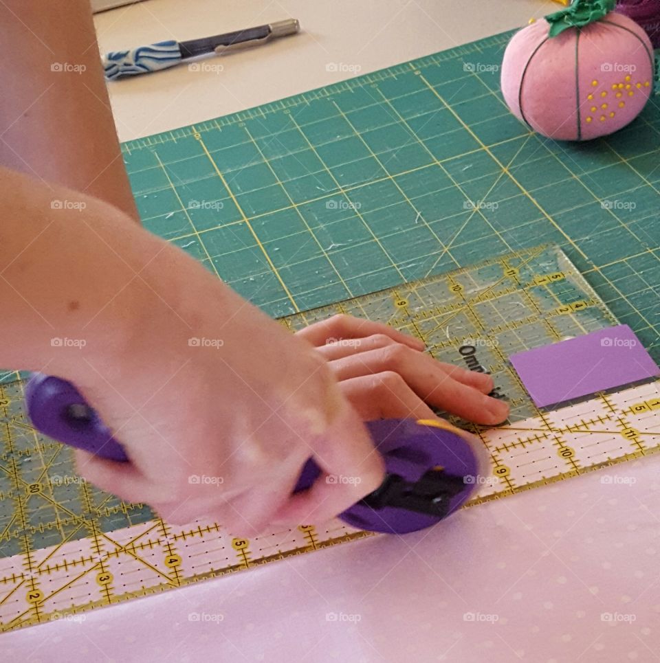 My daughter in law cutting fabric to make a baby quilt.