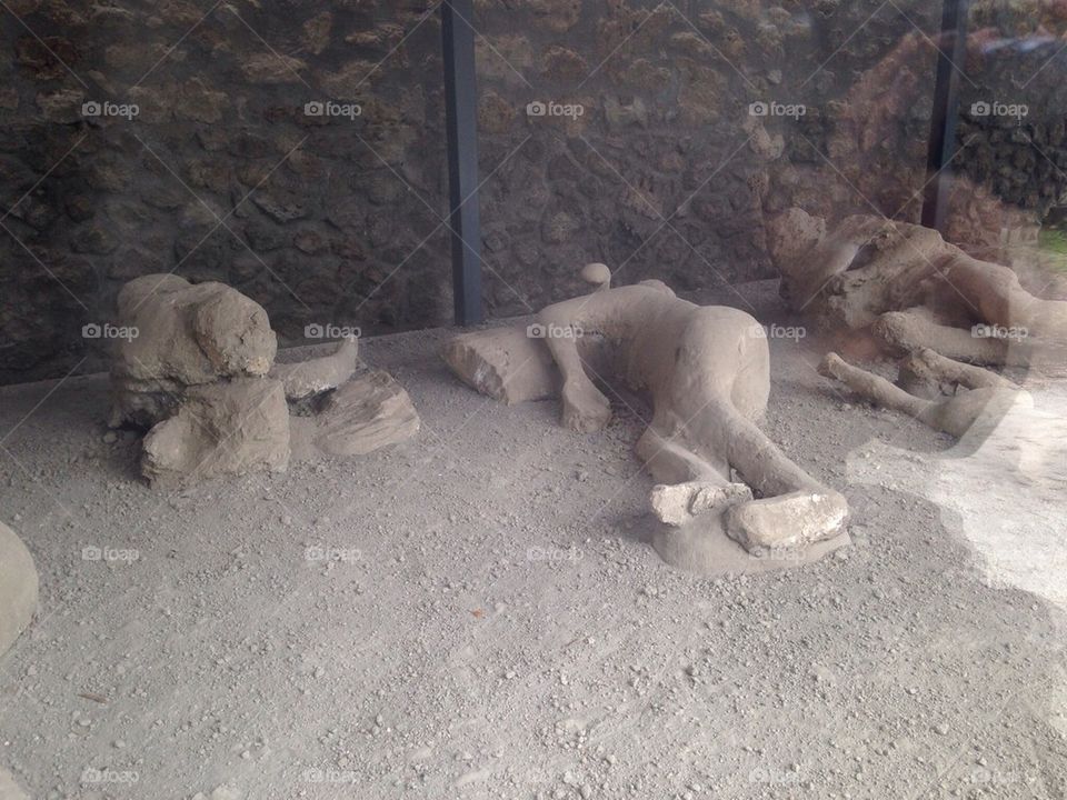 The ancient site of pompaii (pompai ) near Naples in Italy - the replication of the unearthed human figures buried in the ash from the eruption of Vesuvius volcano