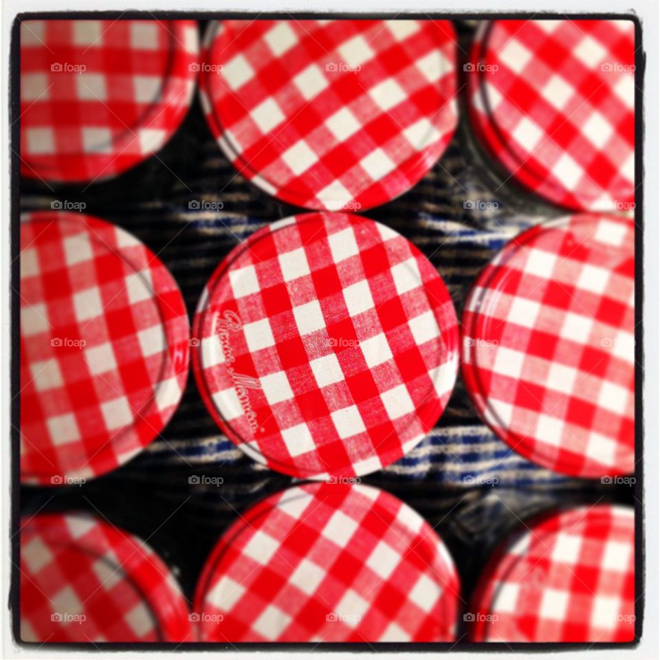 Group of jam jars with red gingham lids
