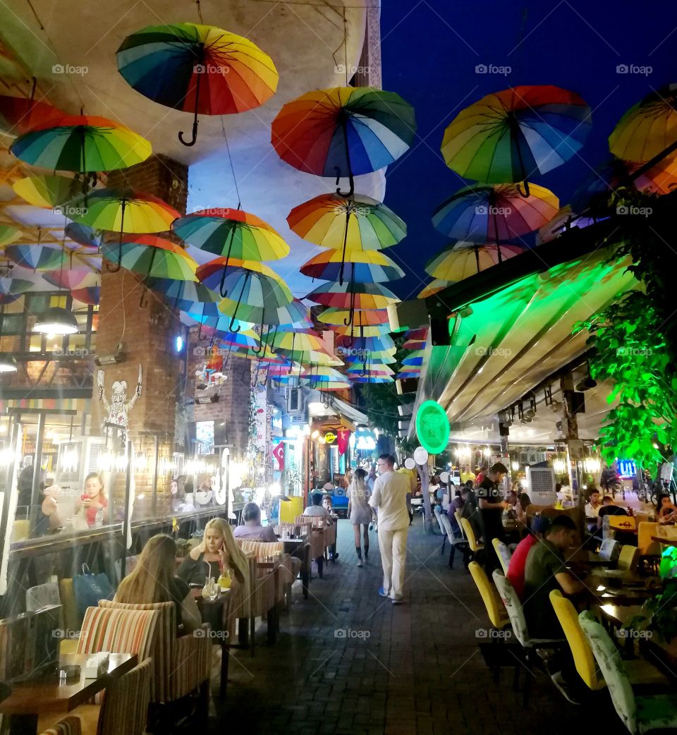 Cafe with umbrellas.  Mobile photo.  For editorial use.