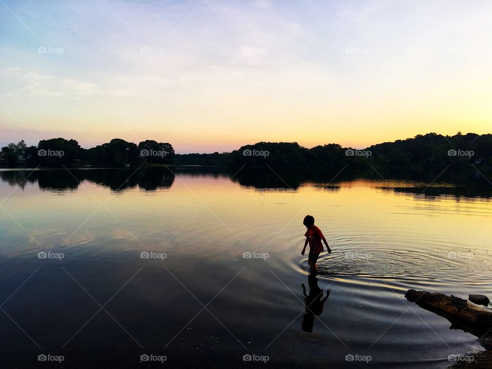 Boy cools off after a hot day 