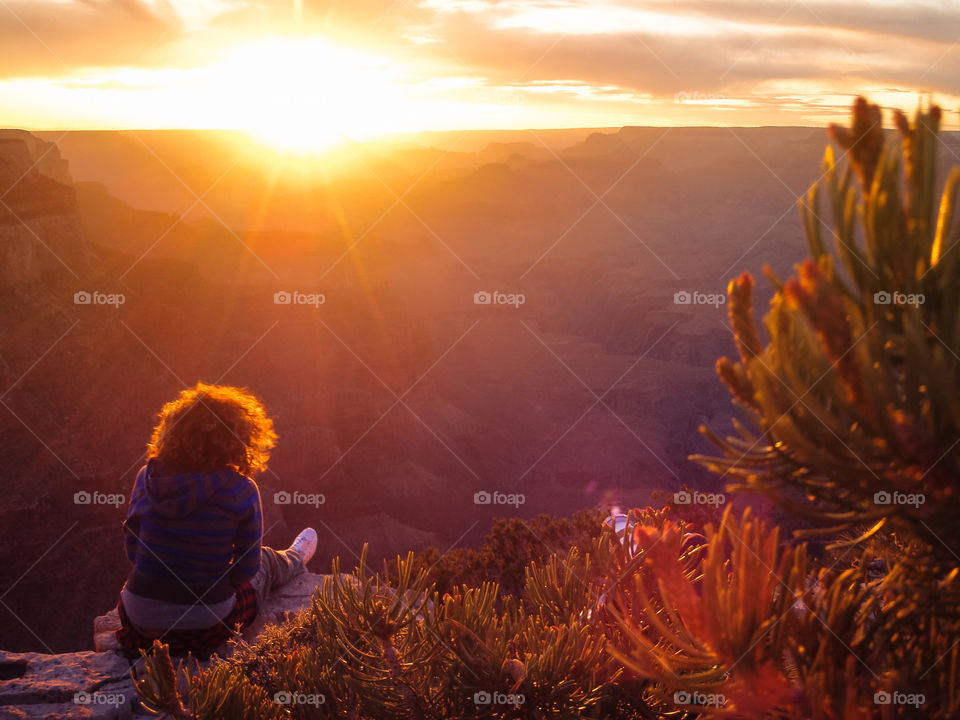 Grand Canyon sunset . Magic hour with a women at the Grand Canyon Arizona national park