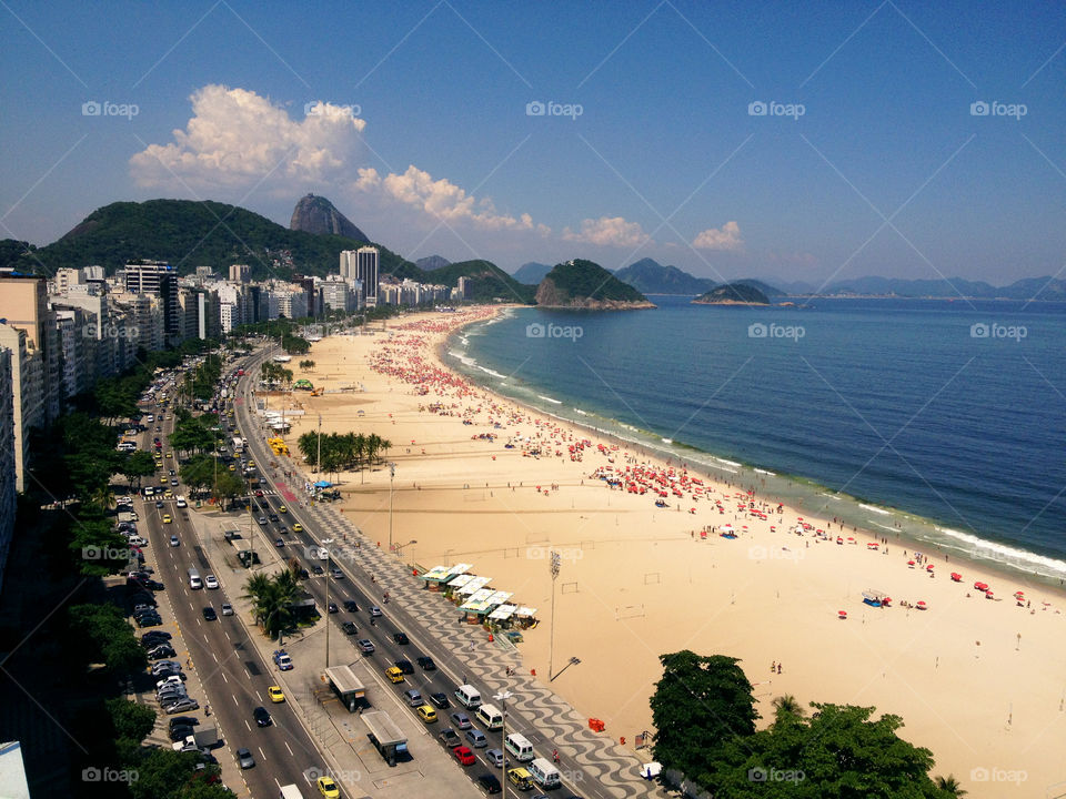 Copacabana beach. The most famous beach in the world is seen from above in a standard afternoon. 