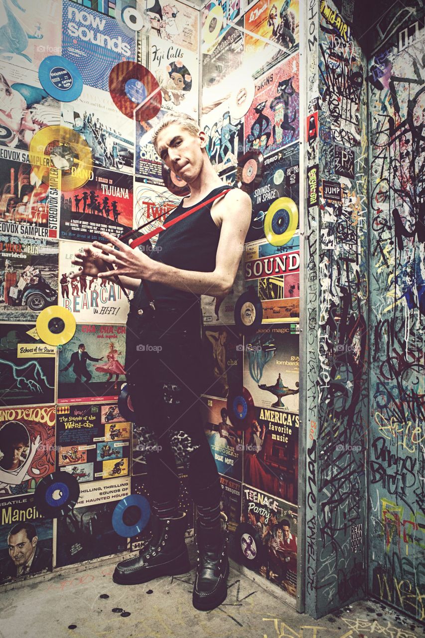 Man standing near poster