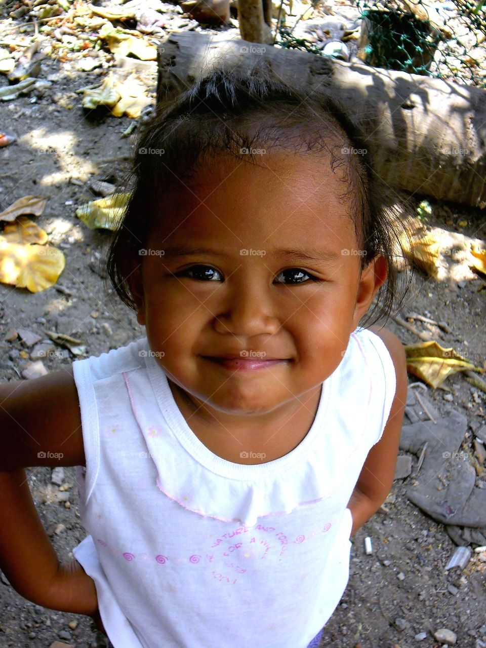 young asian kid smiling at the camera