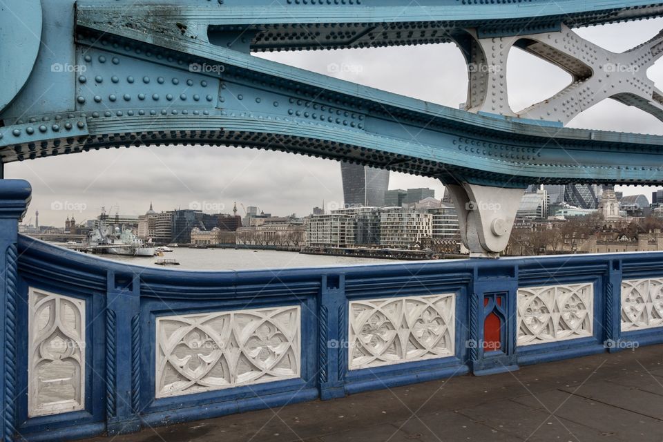 View of buildings in London from pedestrian way of Tower Bridge