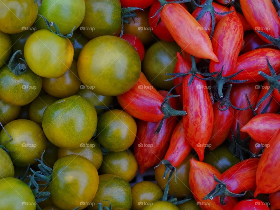 Red And Green Tomatoes. Fresh Ripe Heirloom Tomatoes From The Farmer's Market
