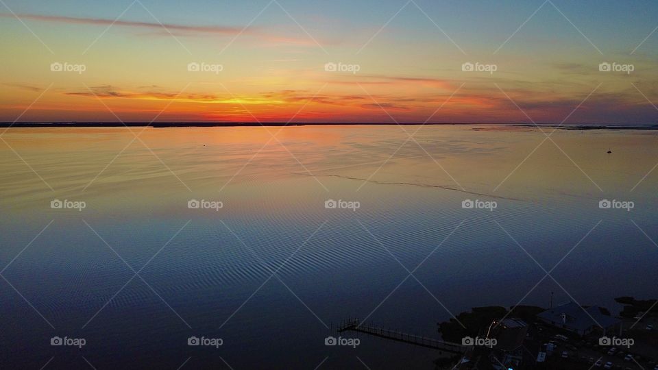 beautiful birds eye sunset in Duck, NC taken by aerial pointe drone 