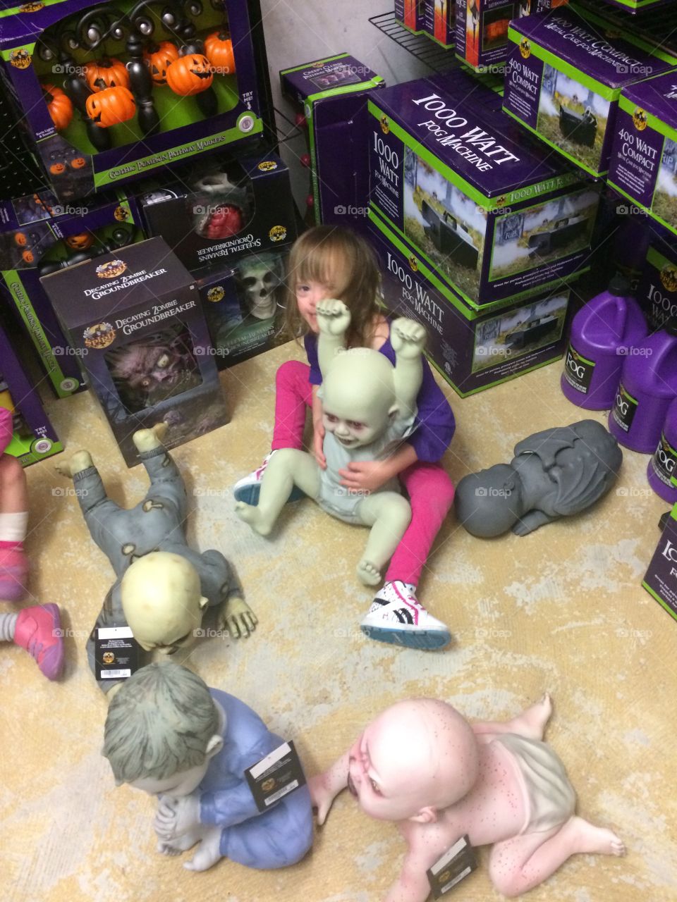 Little girl with Down syndrome at the Halloween store