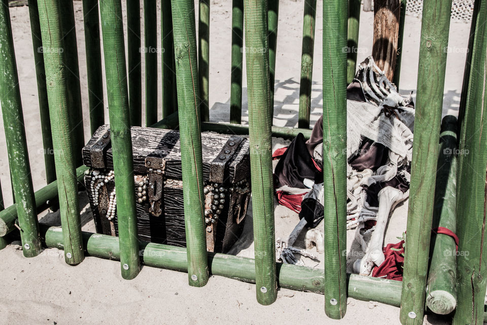 Pirate treasure in the wooden cage.