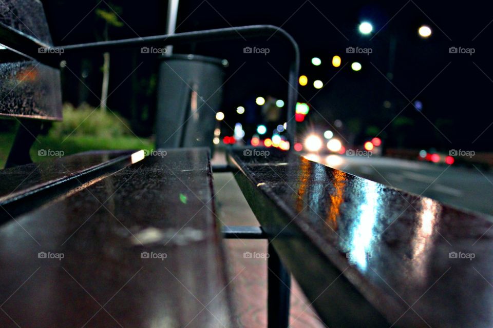 Bench in the street under the night lights