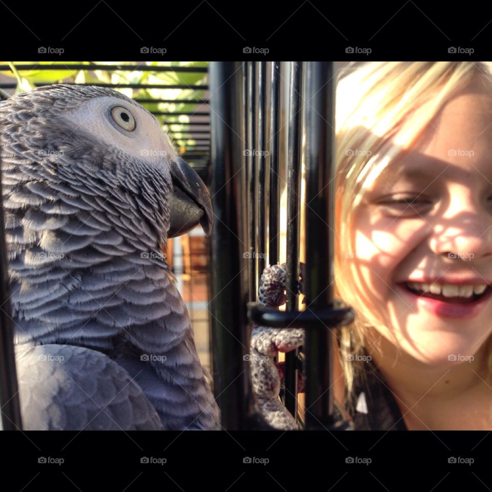 Spring. Parrot and girl