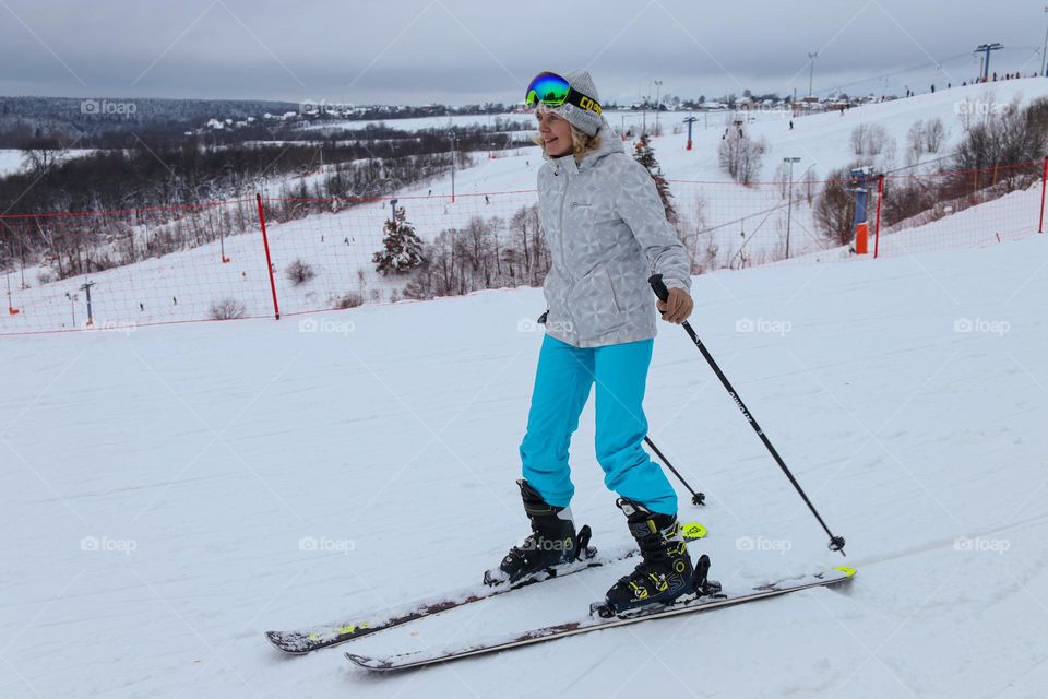 young woman skiing downhill