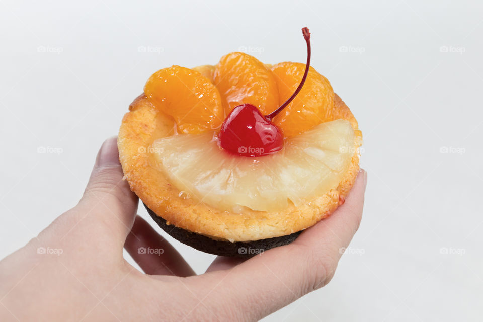 Close-up of a cake in hand