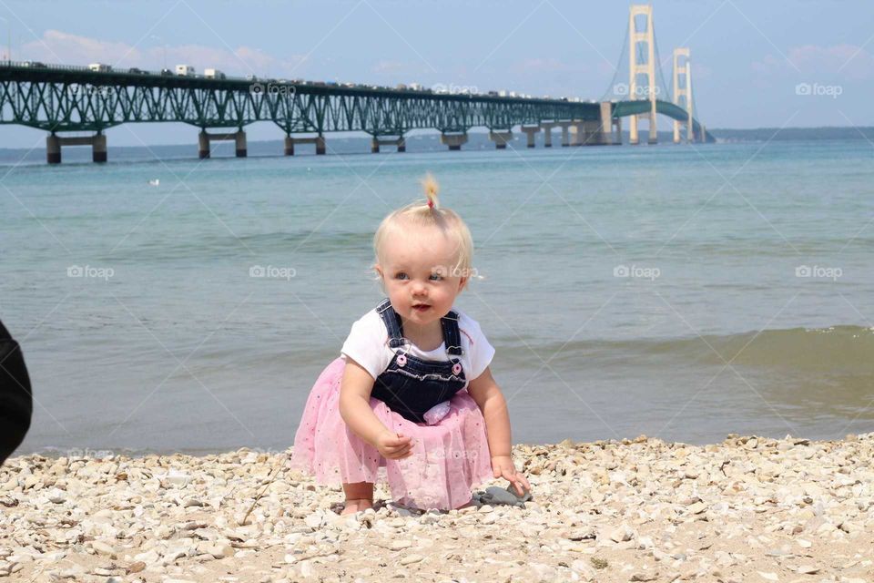 Playing in the Sand by Mackinaw bridge