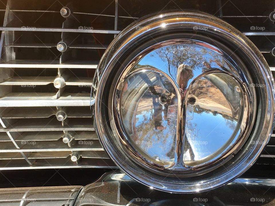 Rare and original cats eyes headlights on 1962 gold Cadillac deVille