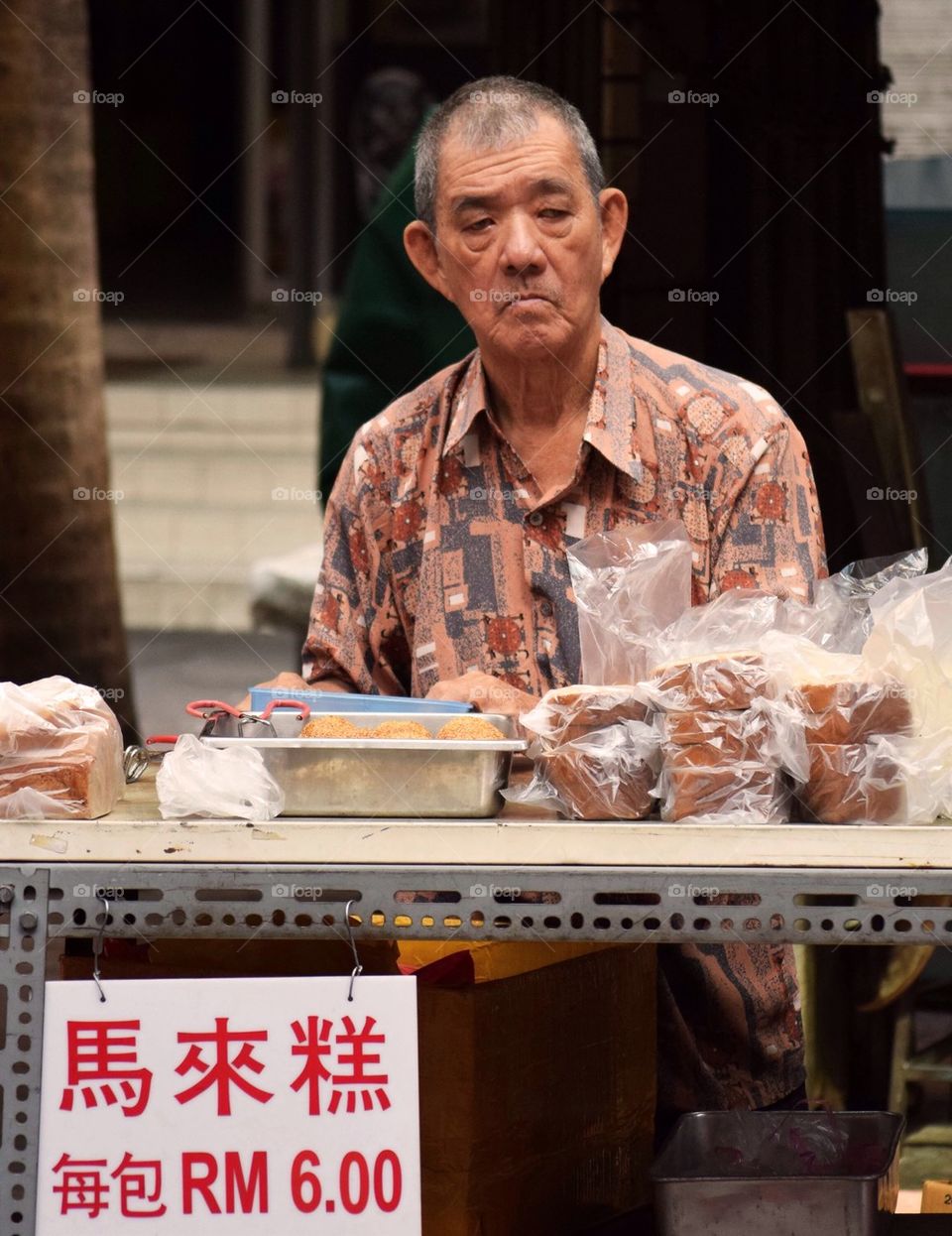 Oldman selling dessert