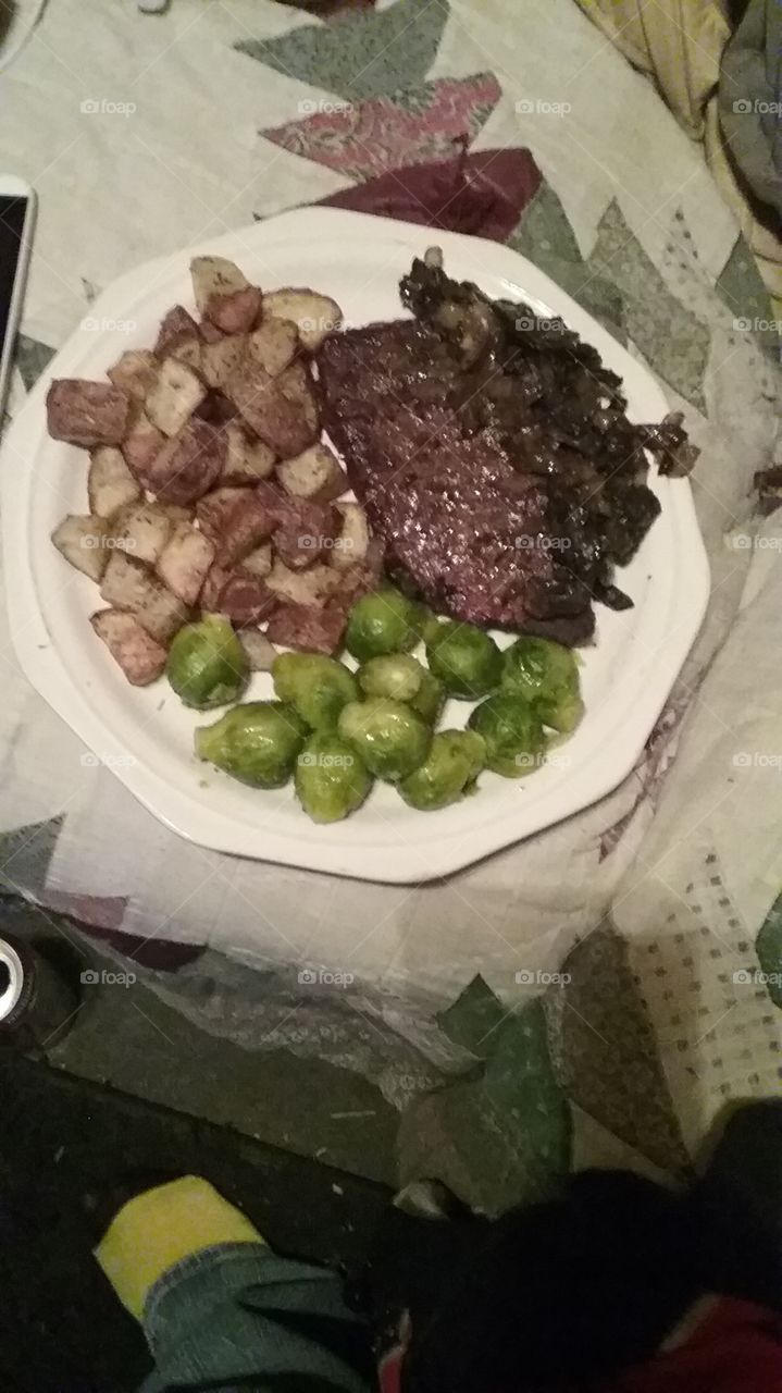 steak well-done mushroom and onion brussel sprouts and baked Redskin garlic and herb potatoes