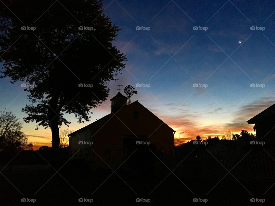 Silhouette of house during sunset