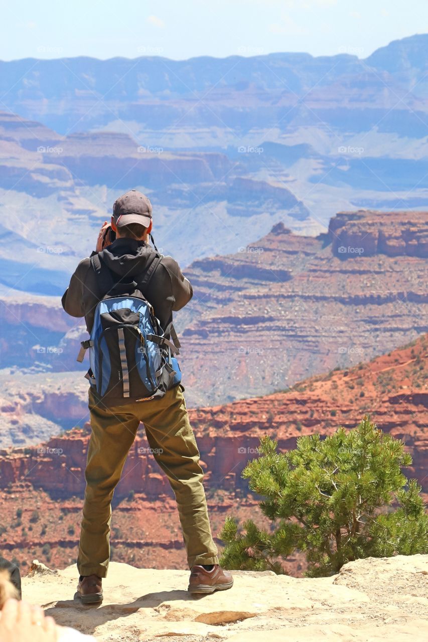 Man taking picture at the Grand Canyon
