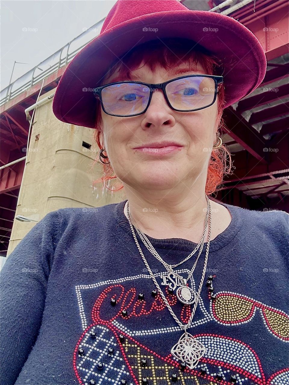 This is me, “Petra Schiller” a.k.a. “Maxine Firefox” a.k.a. “Maximiliane Feuerfuchs” standing in the parking lot beneath the “Pulaski Bridge” at “Newtown Creek” in LIC, Queens. 2024. Hypnotic Productions