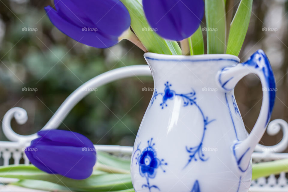 Blue tulips in the Vase On daylight Outdoor 